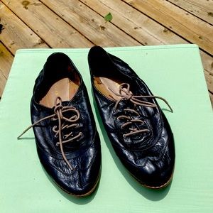 Cole Haan black flat lace-ups